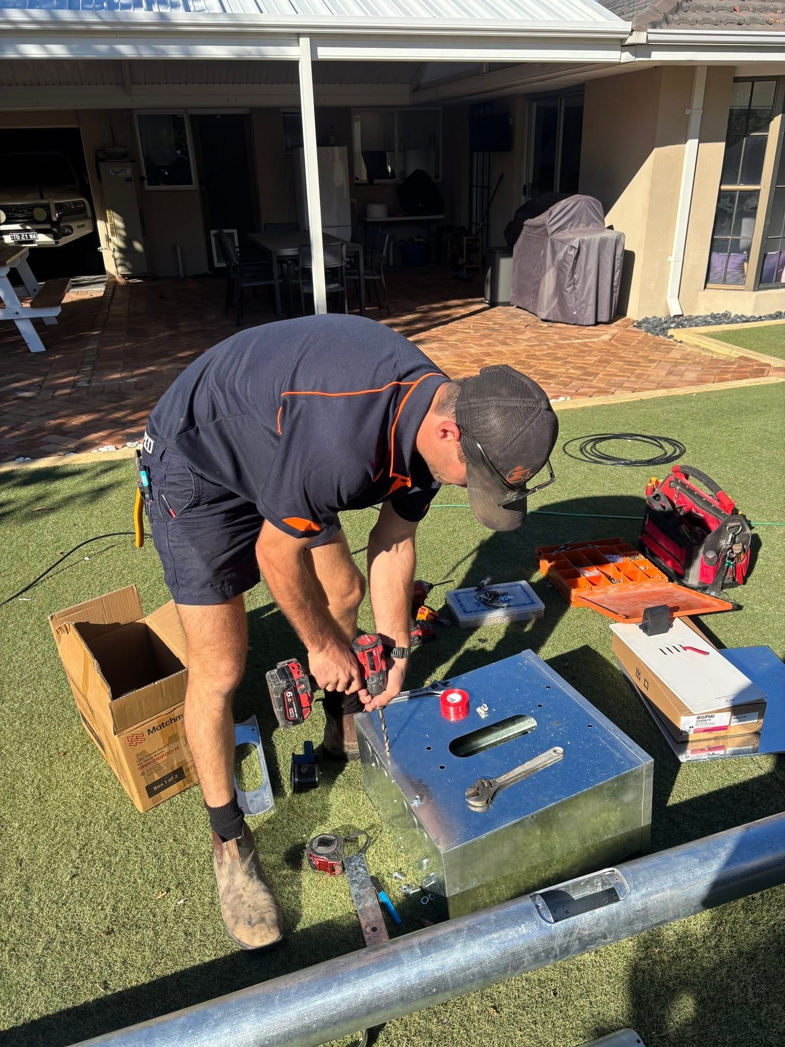 Kade Stewart working on electrical equipment